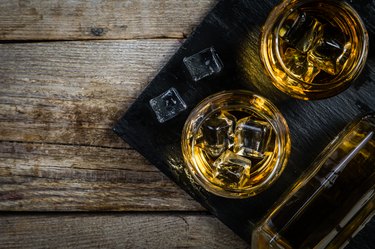 Whiskey with ice in glasses