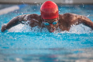 Male swimmer doing butterfly stroke in pool