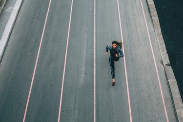 Athletic woman running in the city