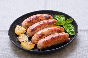 Grilled sausages in frying pan