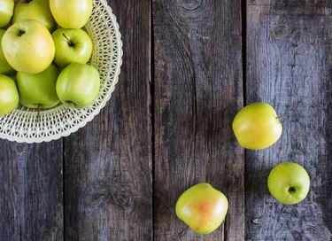 Directly Above Shot Of Granny Smith Apples On Wooden Table