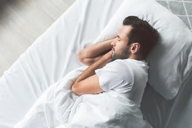 A man sleeping in bed