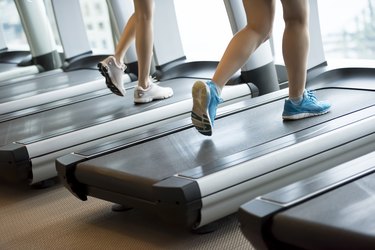 Two women running on the treadmills