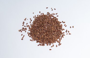 Flax Seeds Over White Background