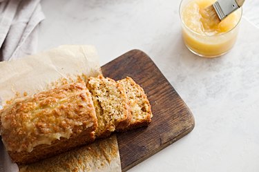 Glazed applesauce  as oil substitute in oatmeal bread on a white marble table