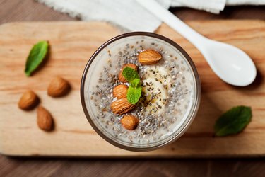 High protein breakfast chia seed pudding with oat, banana and almonds and mint