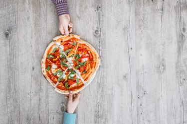 Friends sharing a Pizza Hut Personal Pan Pizza