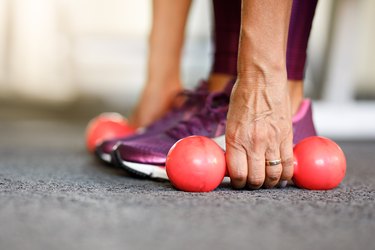 Woman using dumbbells