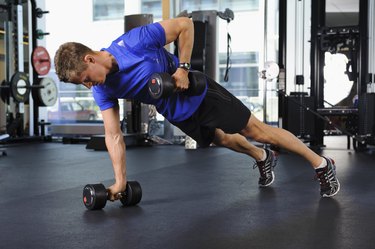 Man exercising to burn fat in gym