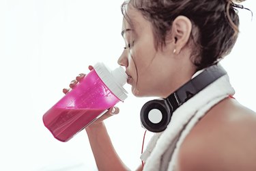 Woman drinking protein powder shake