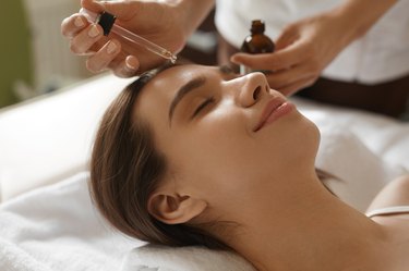 Face Skin Care. Woman Receiving Serum Treatment In Beauty Salon