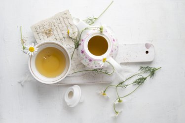 Chamomile tea in pot and cup