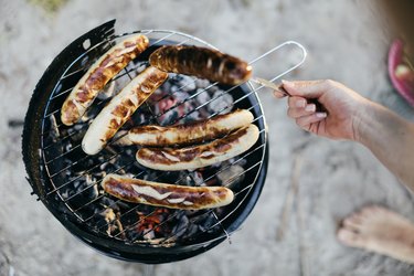 Woman cooking on grill