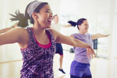 Enthusiastic women enjoying aerobics class