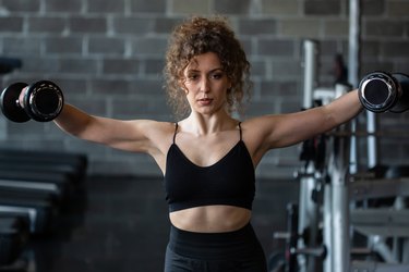 Woman exercising in gym.