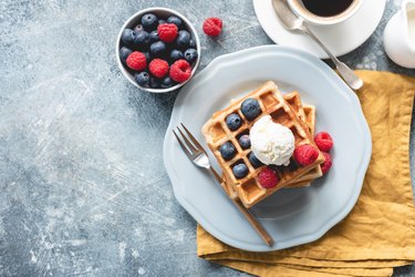 Belgian waffles with ice cream and berries