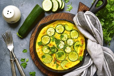 Oven baked omelette with zucchini in a cast iron pan