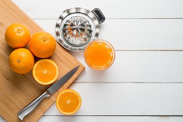 Oranges And Juice On Table