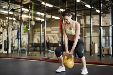 Strong Woman Lifting Weights