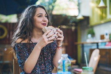 Woman eating McDonald's veggie burger