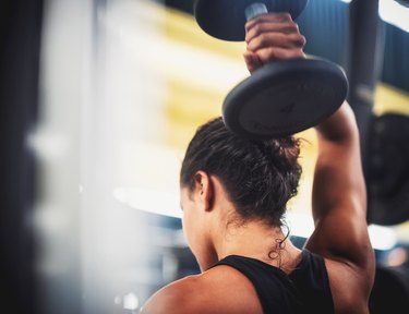 Close-Up Of Woman Lifting Weight