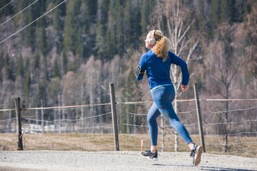 Young female running in nature.