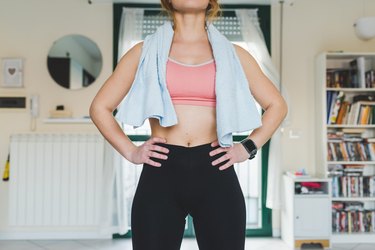 Woman doing an at-home workout with towel