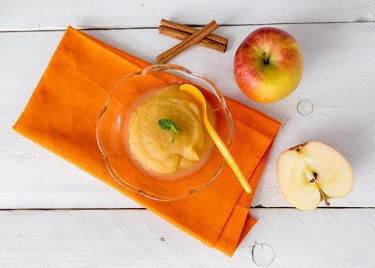 Applesauce with cinnamon and orange spoon