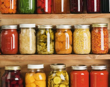 Home Canning Fruit and Vegetable Food Preserves in Storage Shelves