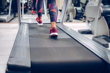 Close up of women while walking on machine