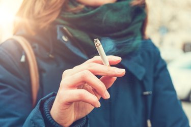 Young woman enjoying a cigarette