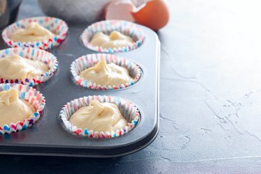 Raw cupcake dough in a cupcake baking dish for yogurt substitute