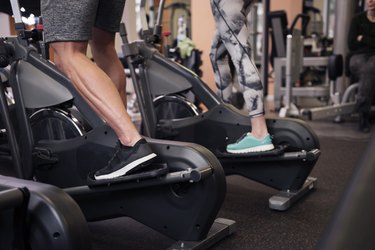 Strong legs of exercising couple