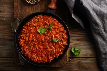 Bolognese sauce in pan top view