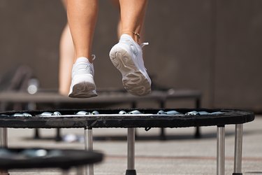 Fitness women jumping on small trampolines