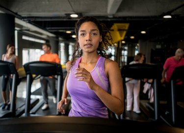 Athletic woman running at the gym