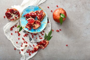 Composition with tasty pomegranates on table