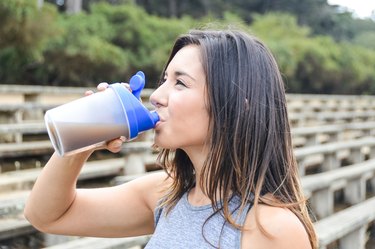 Woman drinking an Herbalife meal replacement shake for weight loss