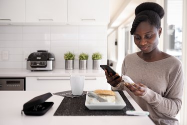 African woman taking blood sugar level in different time of the day