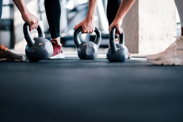 Cross training with kettle bells, low angle image, copy space.