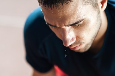 A male runner sweating profusely after a workout