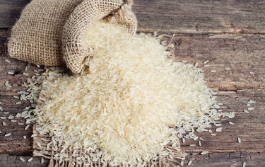 parboiled rice on wooden surface