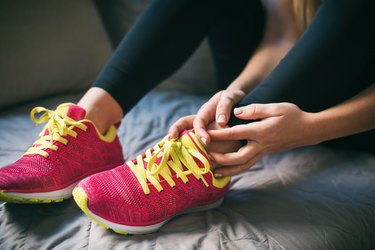 Young sport woman with injured ankle