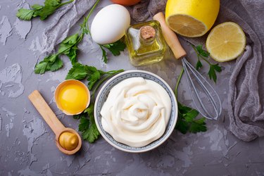 Homemade mayonnaise sauce and olive oil, eggs, mustard, lemon