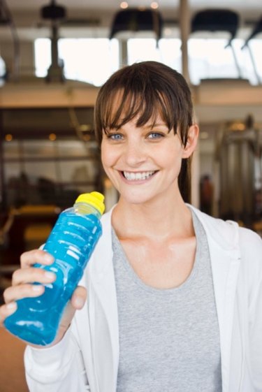 person drinking blue sports drink who lost 80 pounds