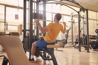 Man doing lat pulldown for better posture