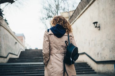 Back view young woman with curly hair