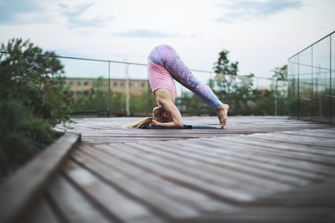 Woman practicing yoga outdoors