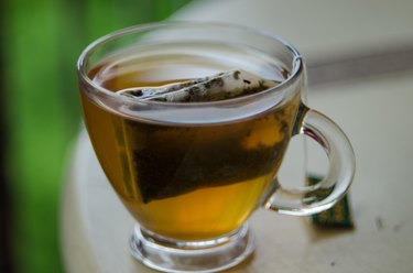 Close-Up Of Green Tea In Cup On Table