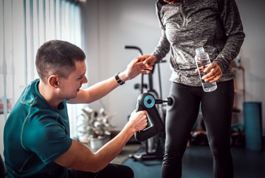 Group of friends doing fitness exercises  in gym